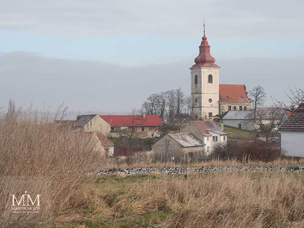 Baroque church in the village. Photograph created with Olympus 12 - 40 mm 2.8 Pro lens.